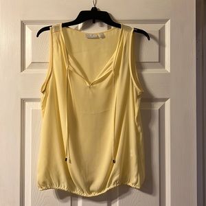 Pale yellow, sleeveless blouse